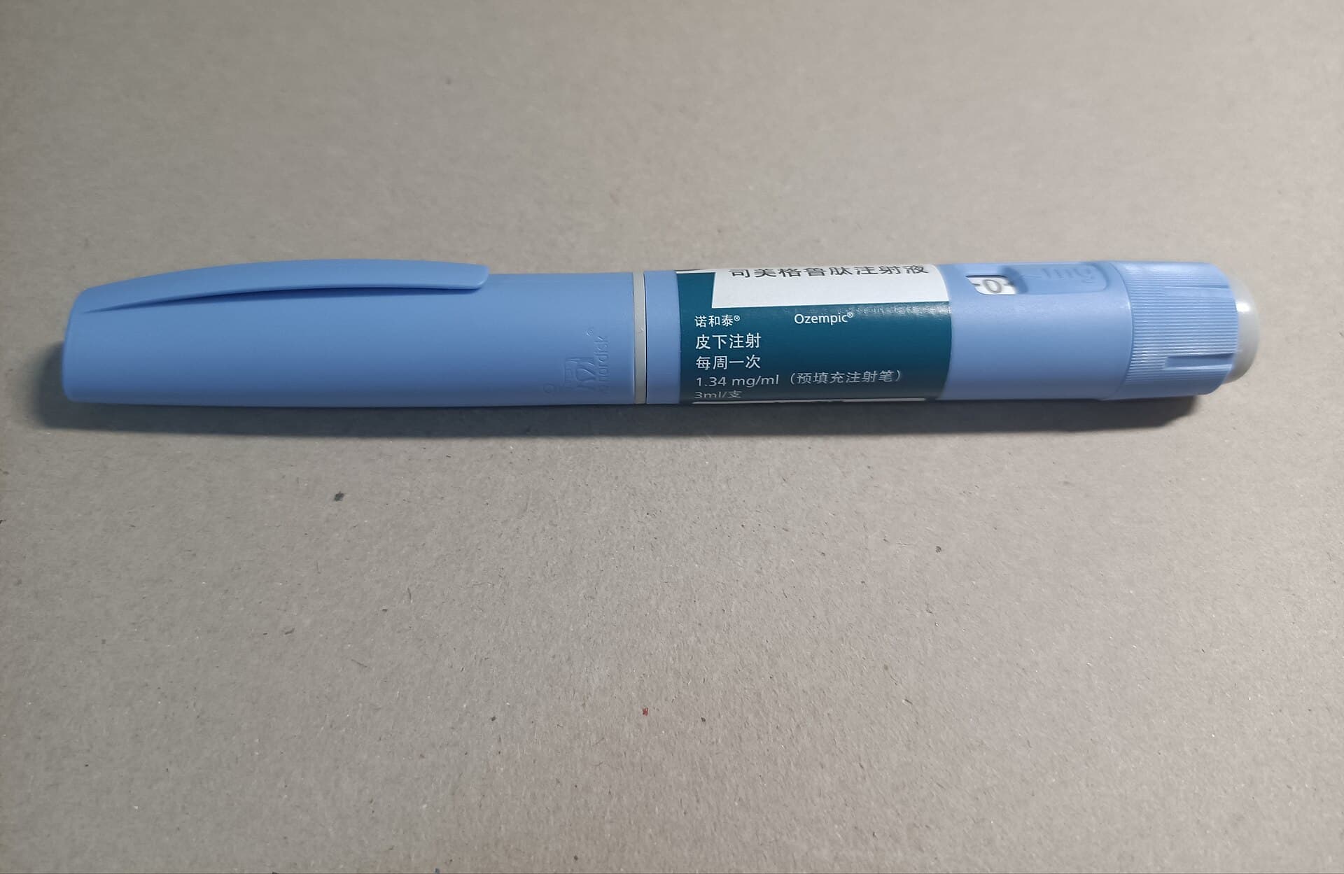 An Ozempic pen, the originator's semaglutide. A dozen Indian generics launched the day its Indian patent expired
